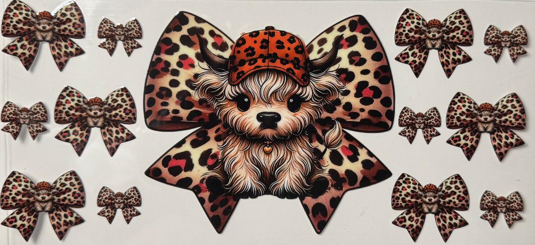 HIghland cow w/ orange hat and cheetah bows